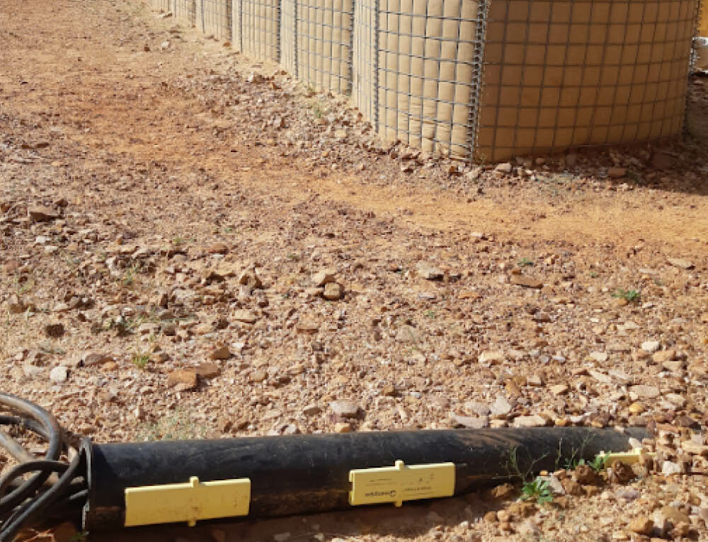 Temporary cable at construction site protected with split pipes - Greenpipe